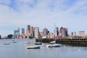 Boats in Boston, representing the importance of hiring a local commercial contractor for projects in New England.